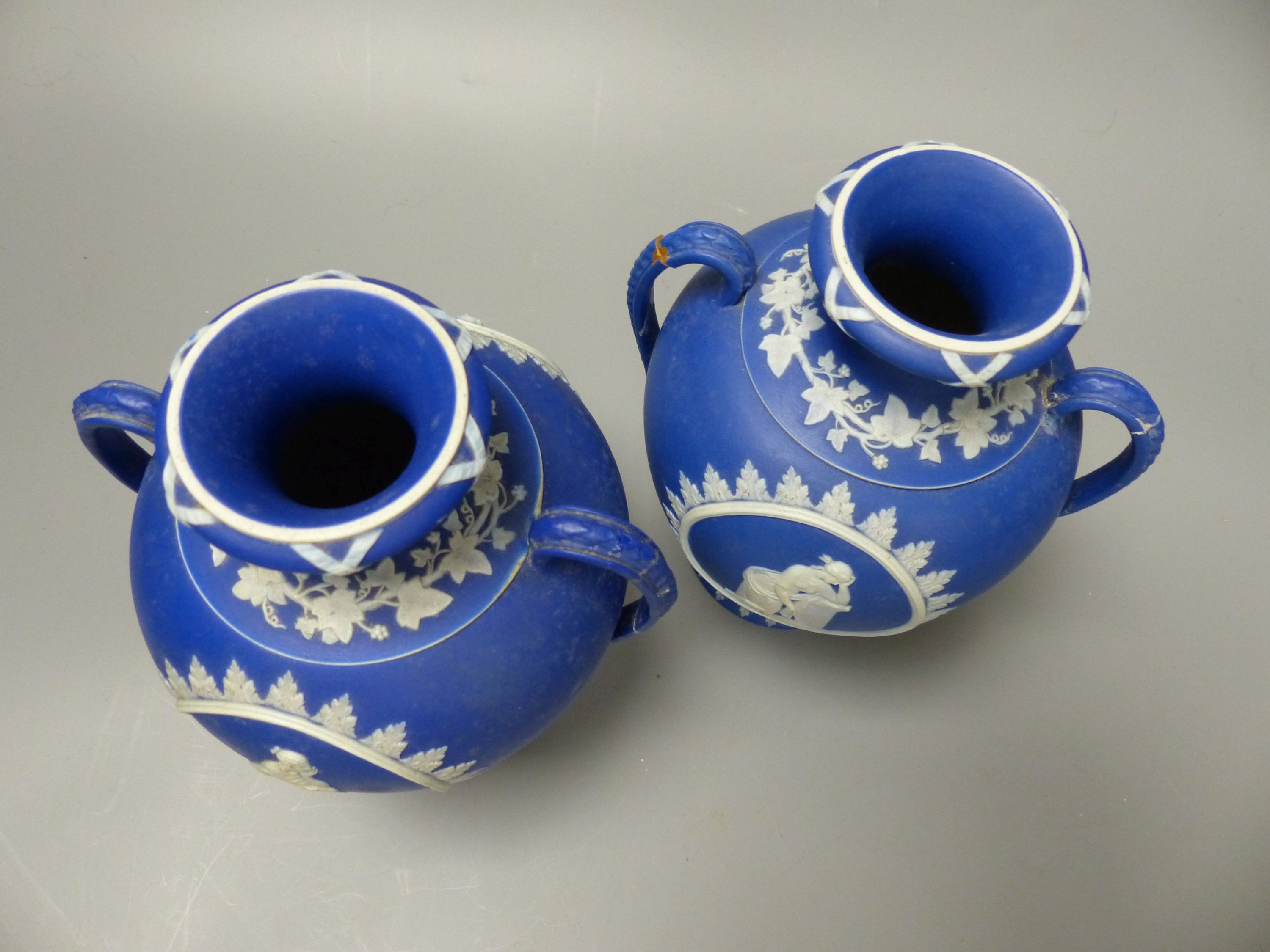 Four pieces of Wedgwood jasper wares including a pair of Victorian blue jasper vases, height 18.5cm, and later dish and pin dish